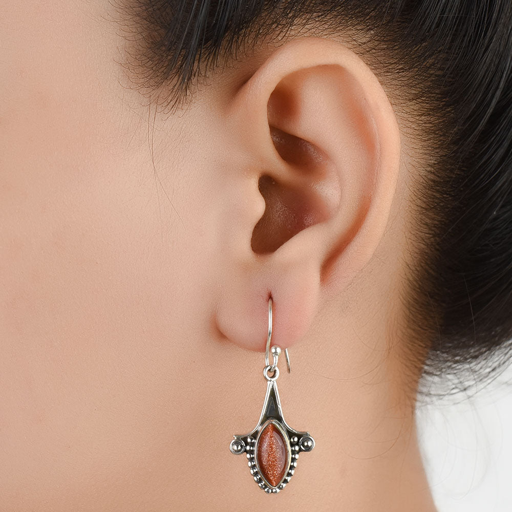 Sun Stone Fish Dangle Earrings handcrafted in 92.5 Sterling Silver with subtle Sun Stone Fish details capturing quiet heritage