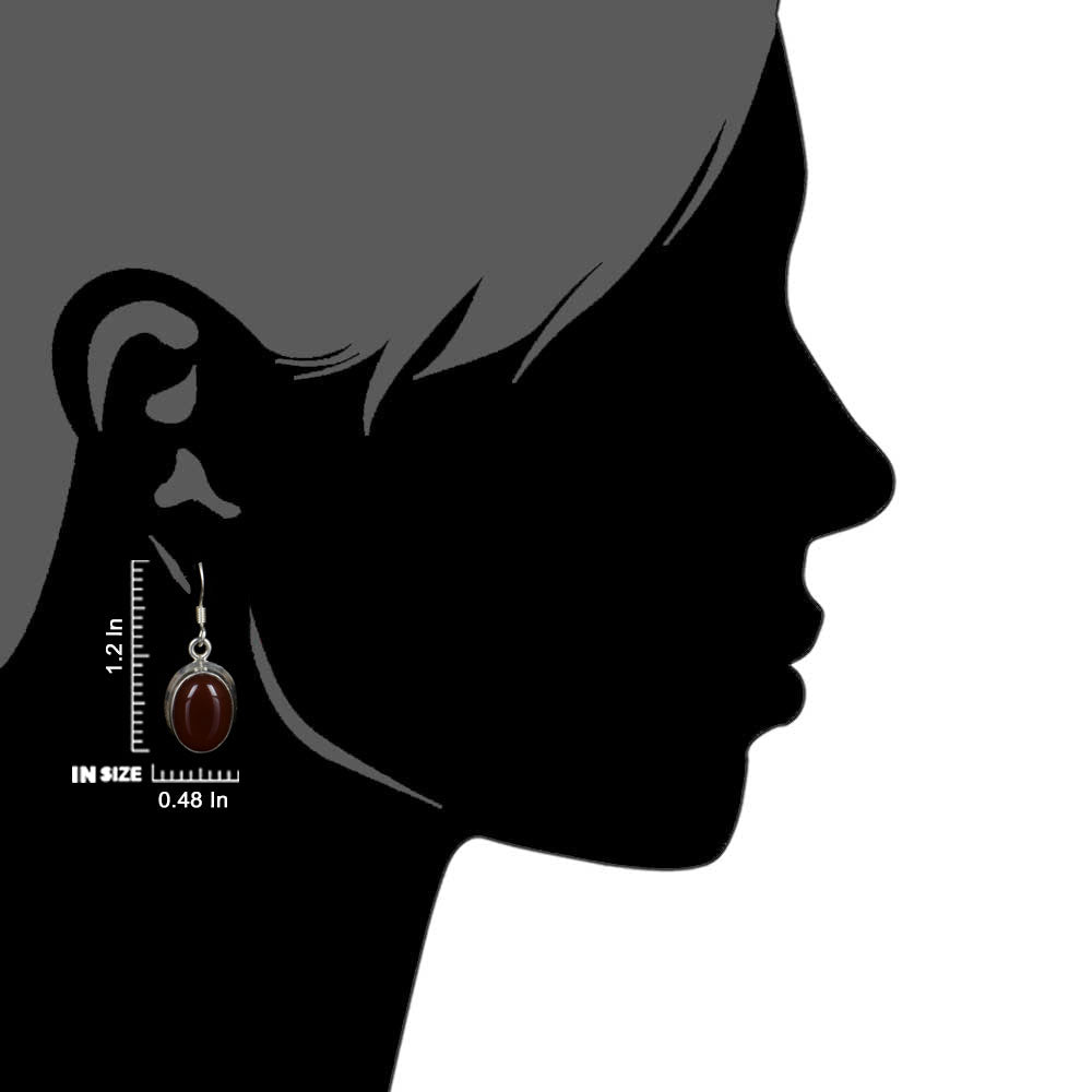 Side view of the artisan made Carnelian Earrings revealing the texture and light play