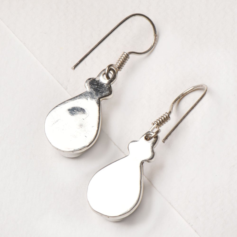 Close up of dangle detailing on 92.5 Sterling Silver earrings