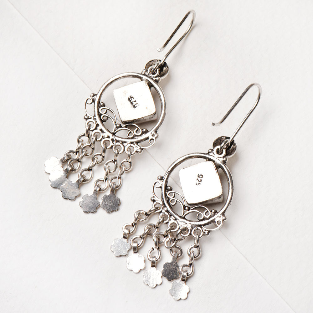 Close up of dangle detailing on 92.5 Sterling Silver earrings