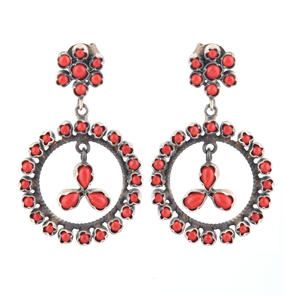 Handcrafted sterling silver coral earrings with circular hanging design