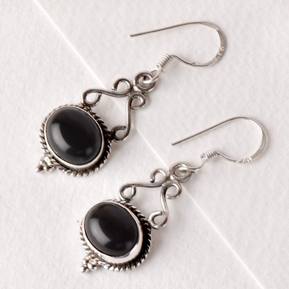 Angled view of Noir Onyx earrings in 92.5 Sterling Silver