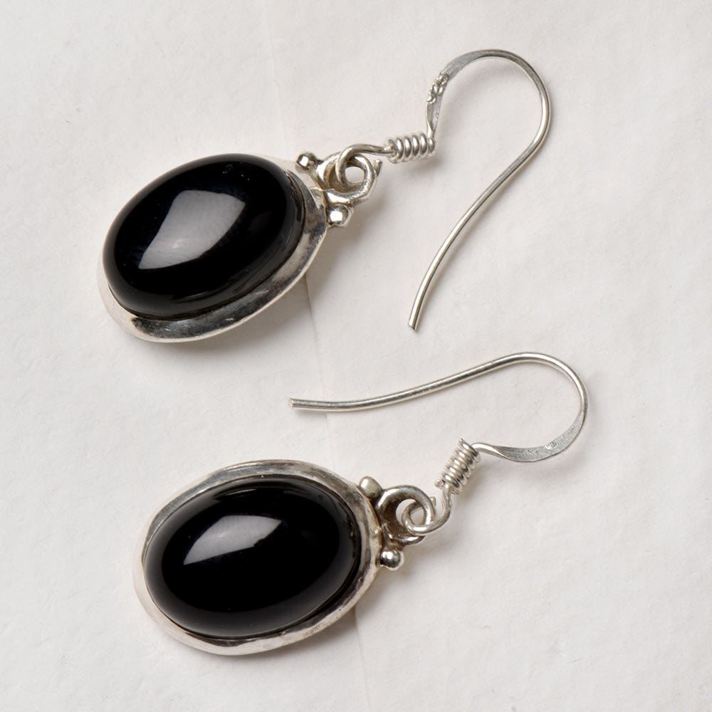 Closeup of Black Onyx Drop Earrings showcasing the detailed drop motif and 92.5 Sterling Silver finish
