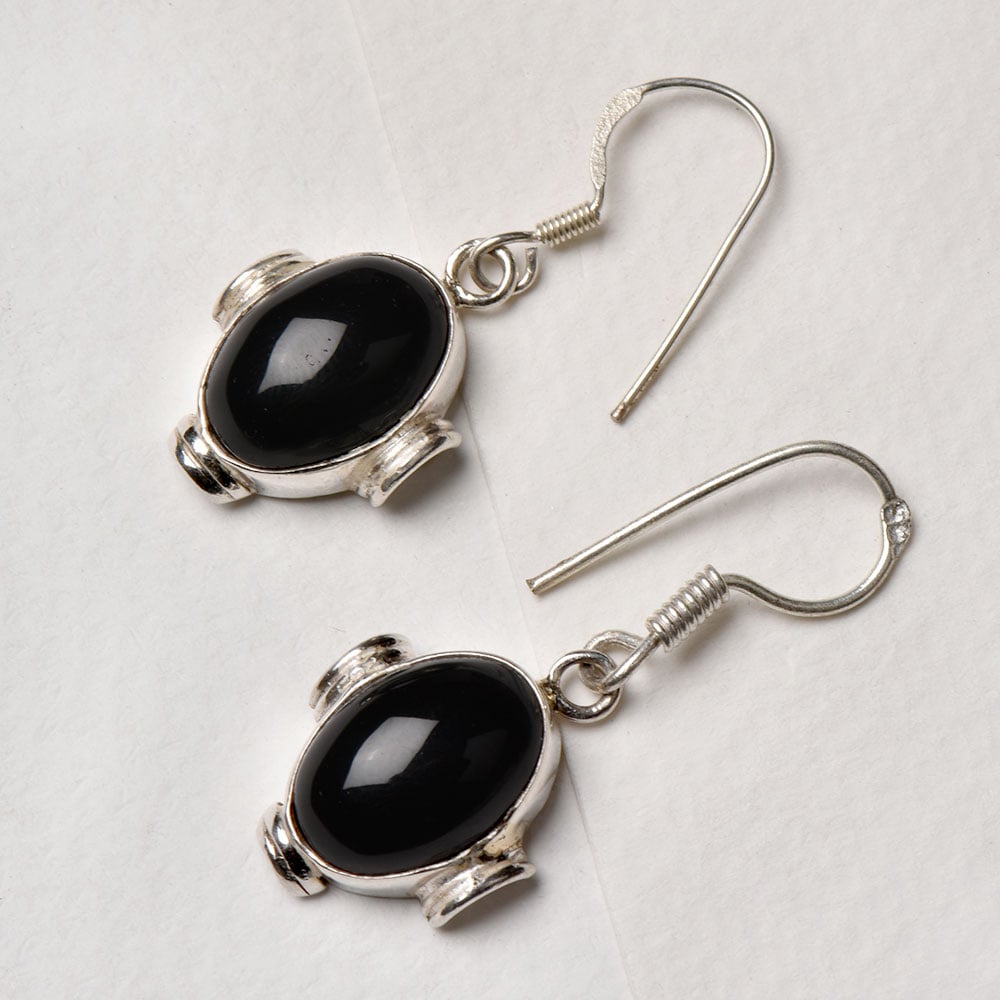 Closeup of Onyx Oval Earrings showcasing the detailed oval motif and 92.5 Sterling Silver finish