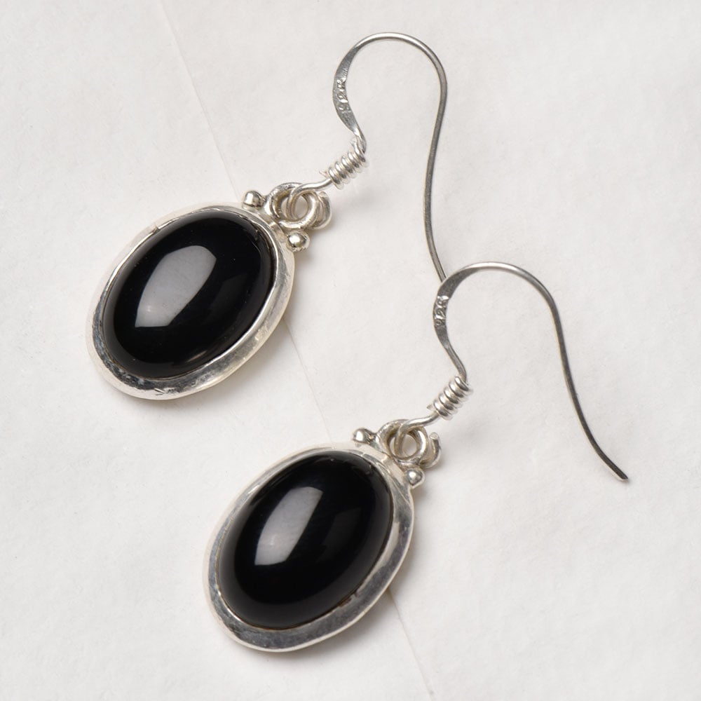 Closeup of Black Onyx Oval Earrings showcasing the detailed oval motif and 92.5 Sterling Silver finish