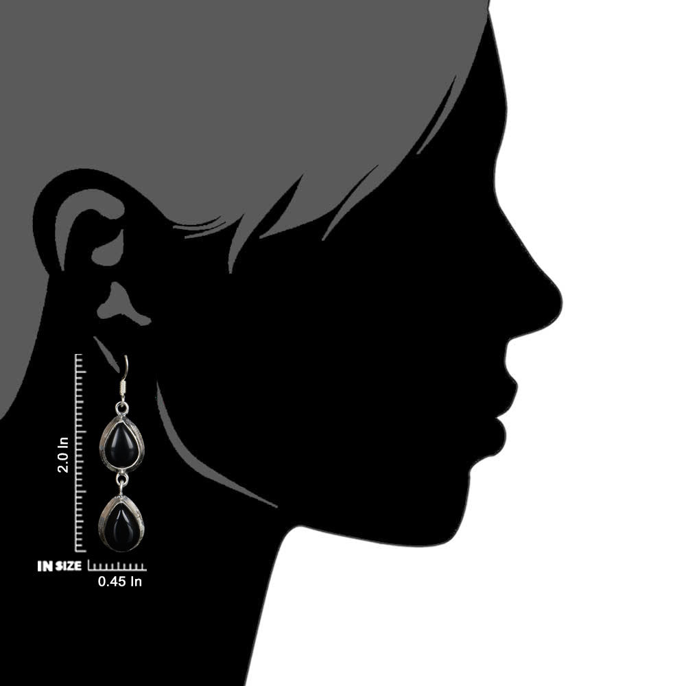 Side view of the artisan made Black Onyx Oval Dangle Earrings revealing the texture and light play