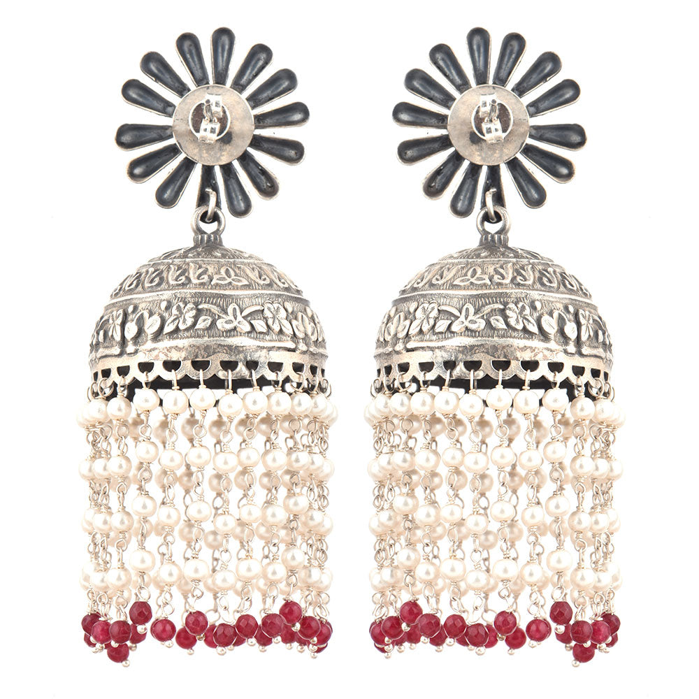 Close-up of intricate gul engraving with red onyx accents