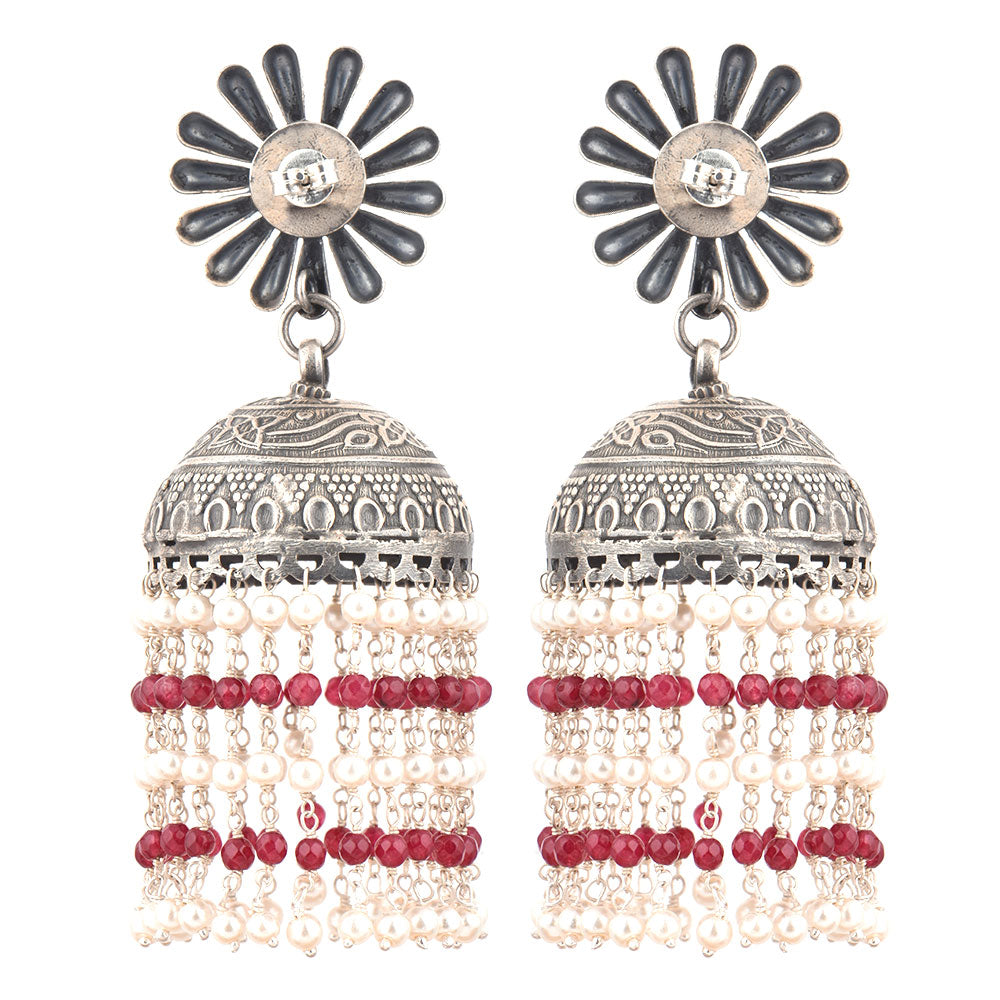 Close-up of intricate chaandni engraving with red onyx accents