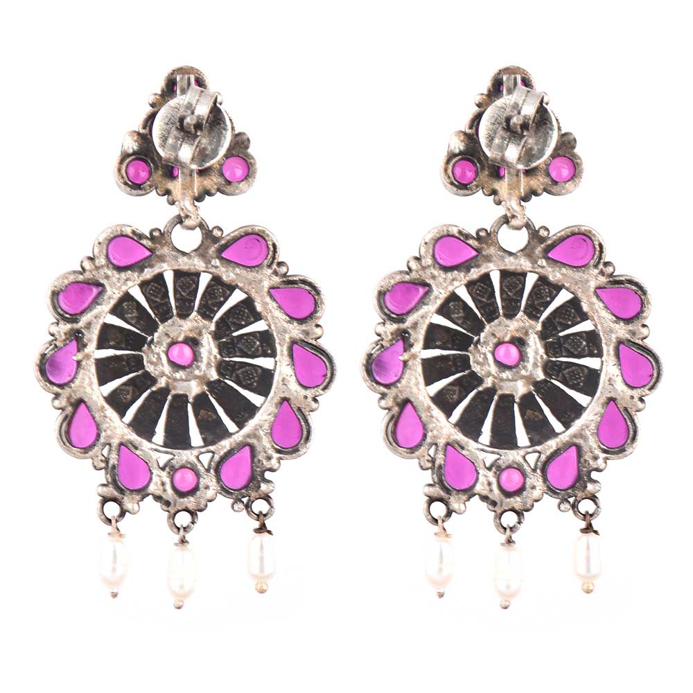 Close-up of intricate floral engraving with sapphire pearl accents