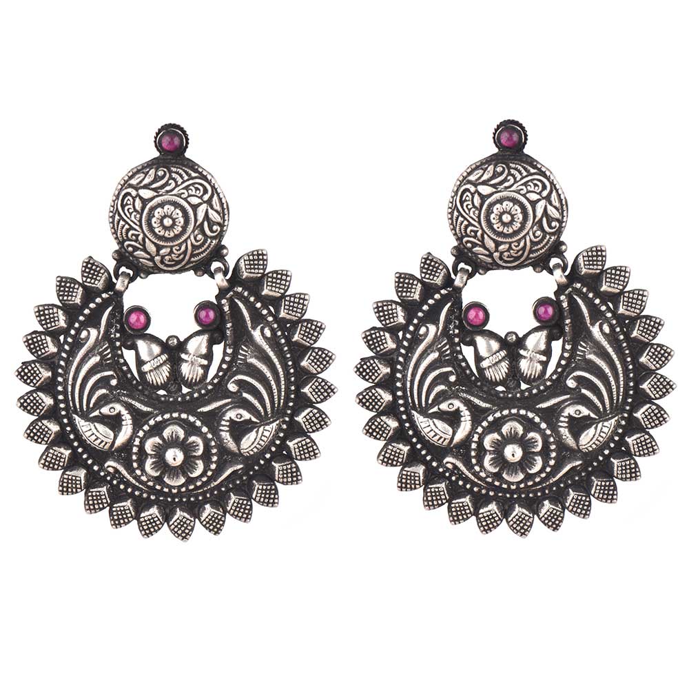Side profile showing silver work on the chandbali earrings