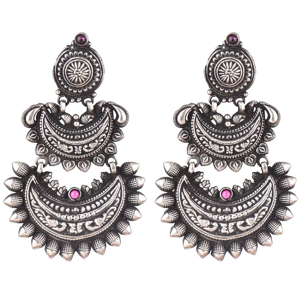 Side profile showing silver work on the chandbali earrings