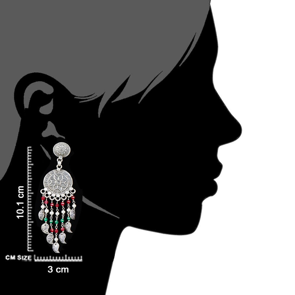 Artisan hands crafting the heritage earrings