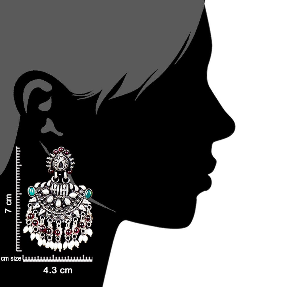 Artisan hands crafting the crescent chandbali earrings