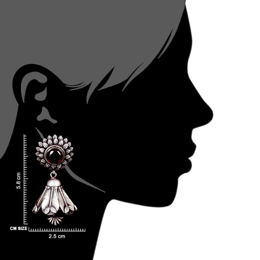 Artisan hands crafting the floral jhumki earrings