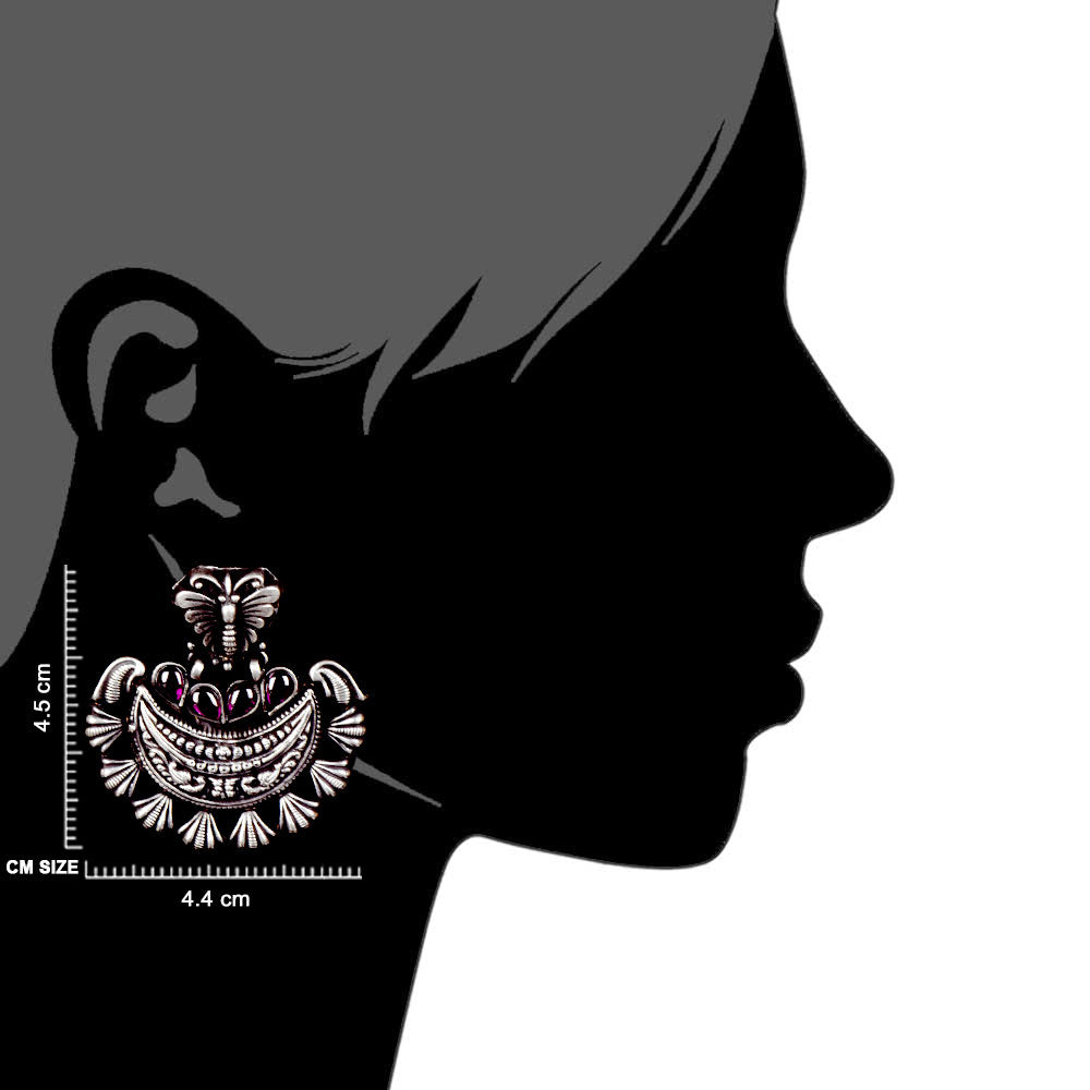 Artisan hands crafting the butterfly stud earrings