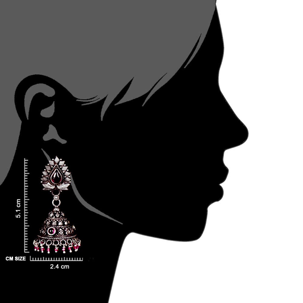 Artisan hands crafting the floral jhumki earrings