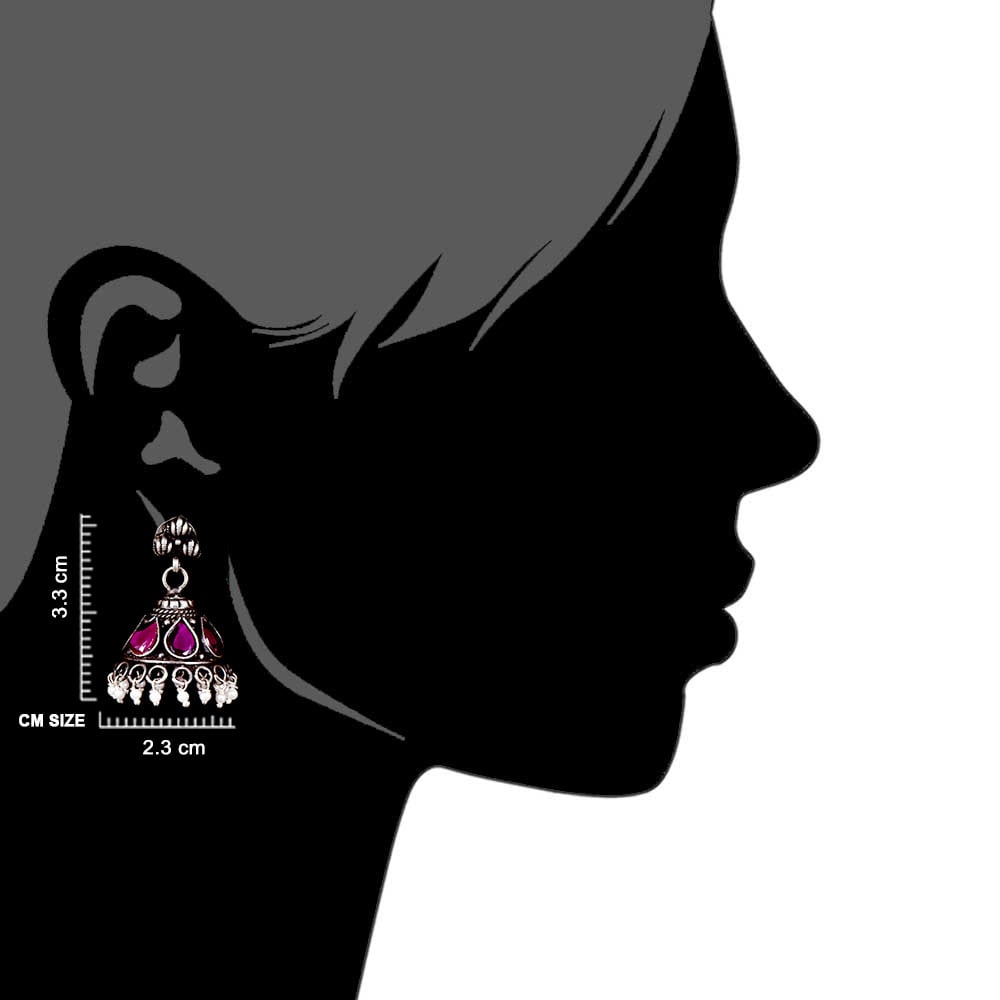 Artisan hands crafting the jhumki jhumki earrings