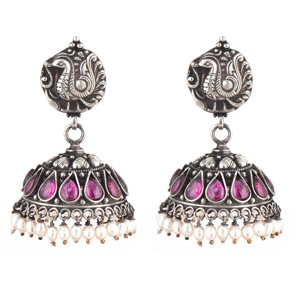 Side profile showing Pearl & Amethyst on the earrings