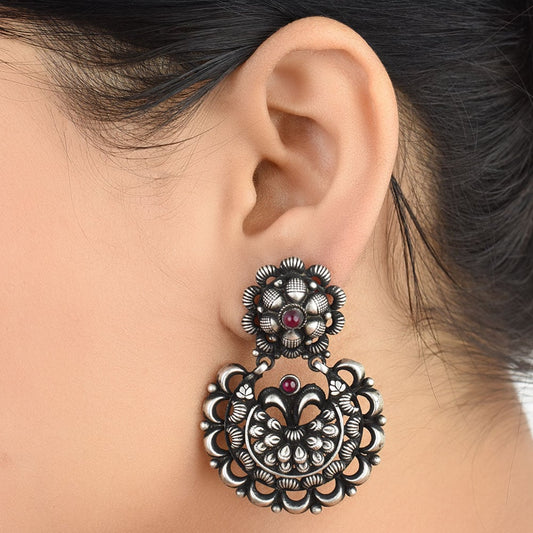 Pair of earrings reflecting light softly