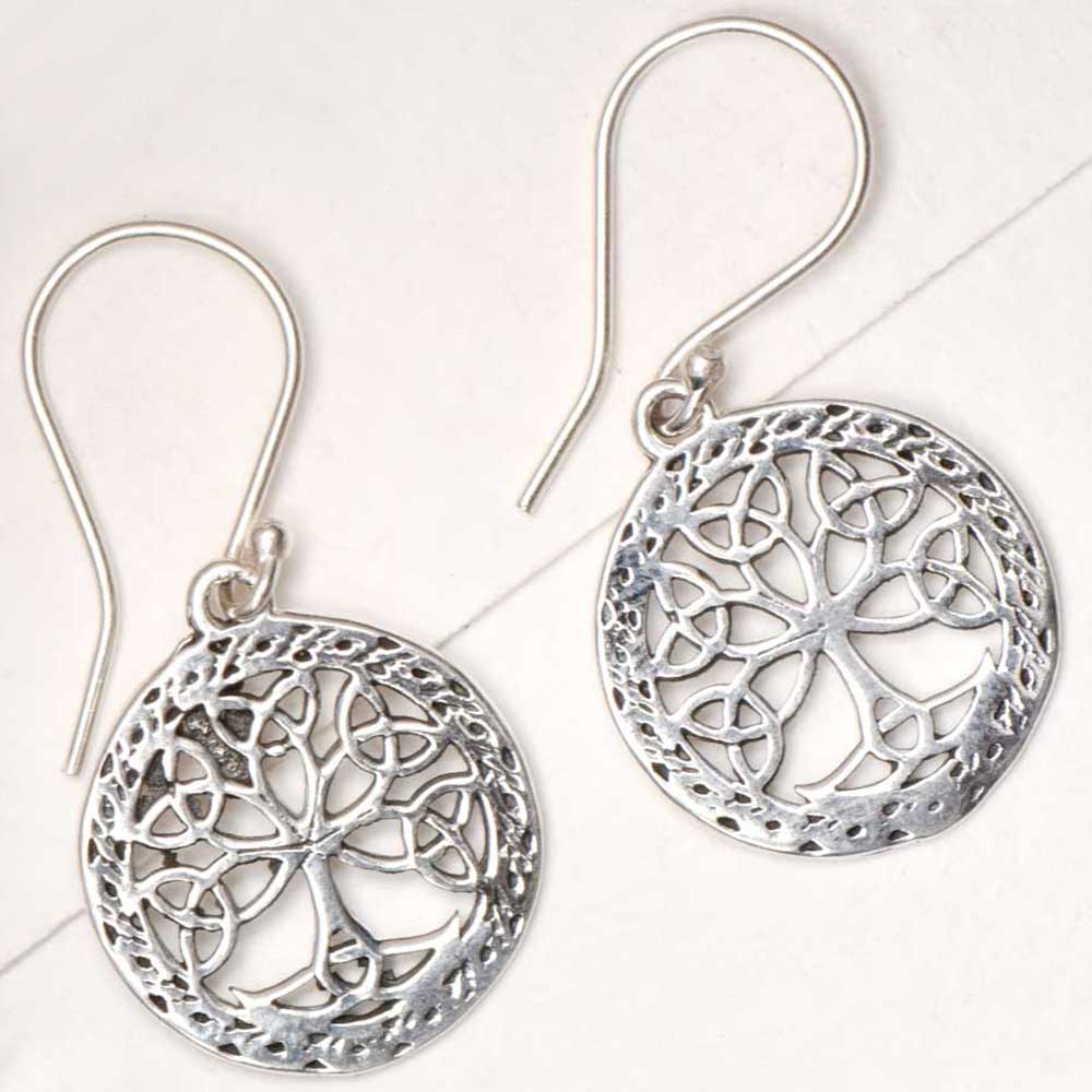 Side view showing tree of life, round design on Reet earrings