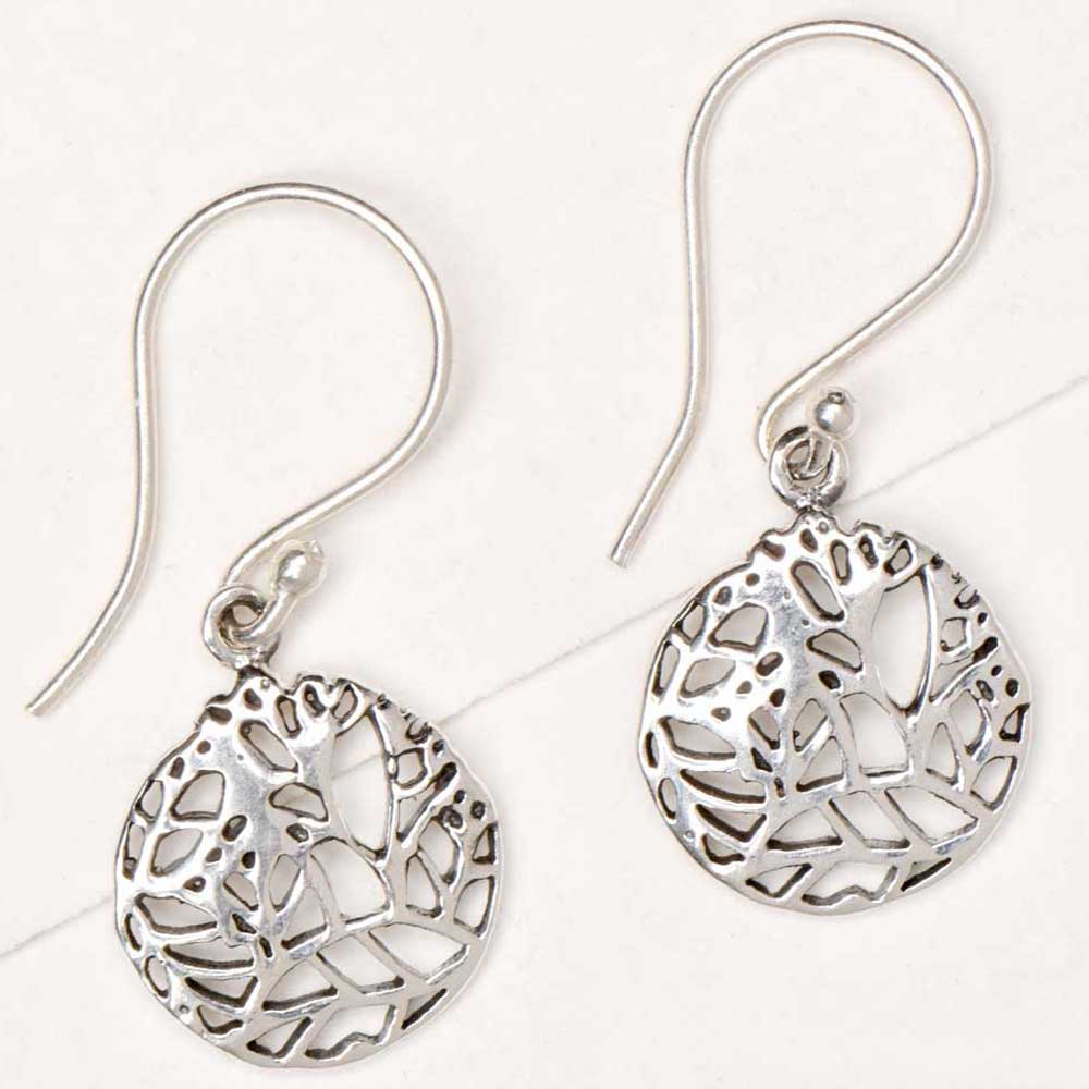 Side view showing geometric pattern, round, drop design on Reet drop earrings