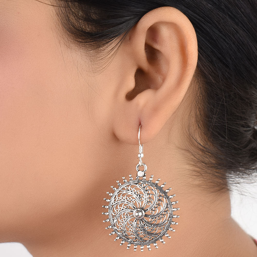 Front view of Surya sun dangle earrings in 92.5 Sterling Silver