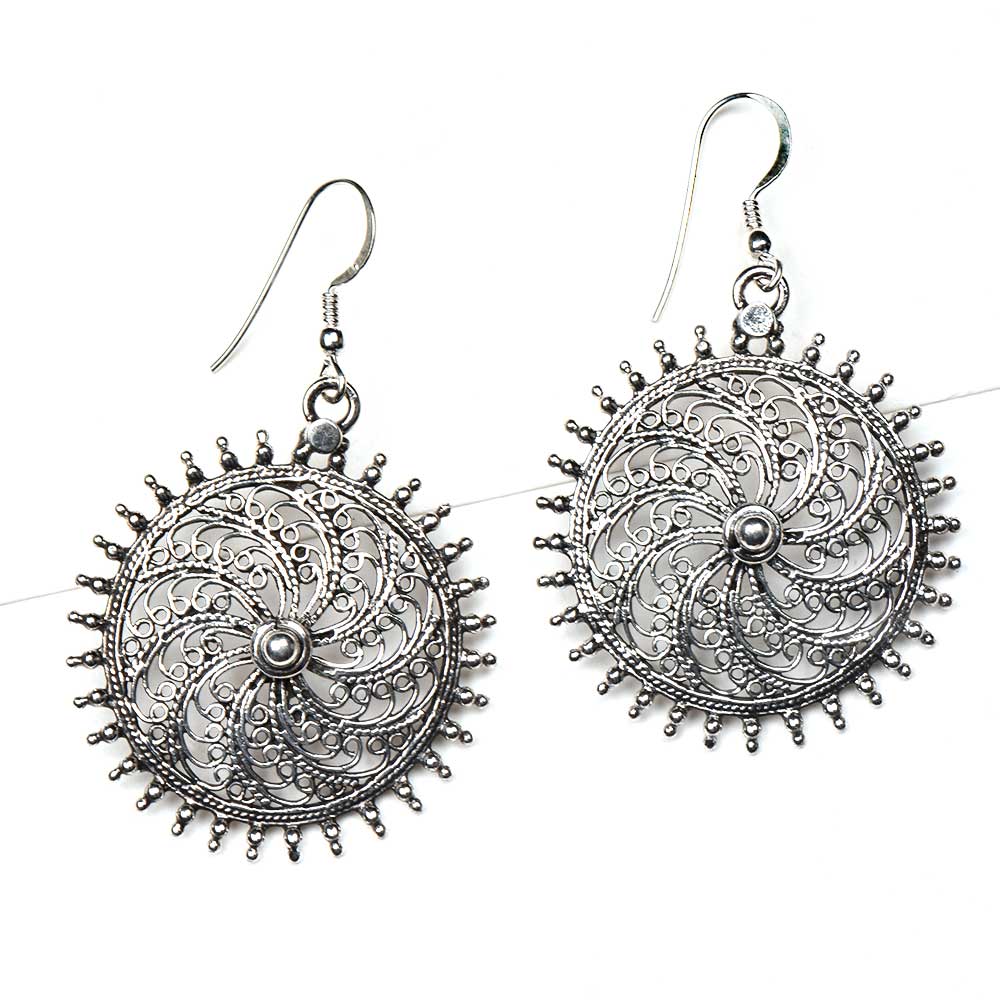 Side view showing sun design on Surya dangle earrings