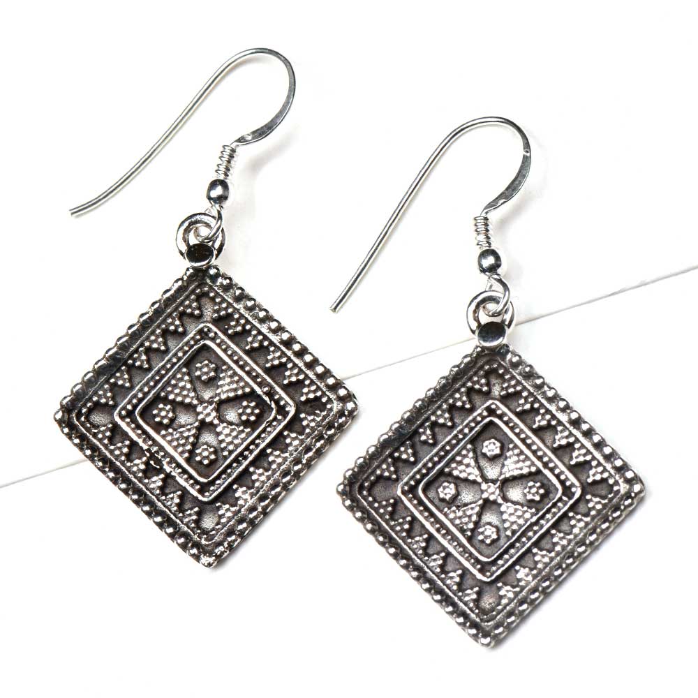 Side view showing square design on Reet dangle earrings
