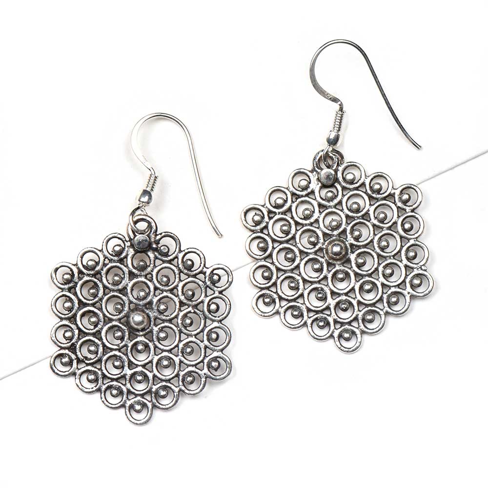 Side profile showing the handcrafted honey and comb and bee motif