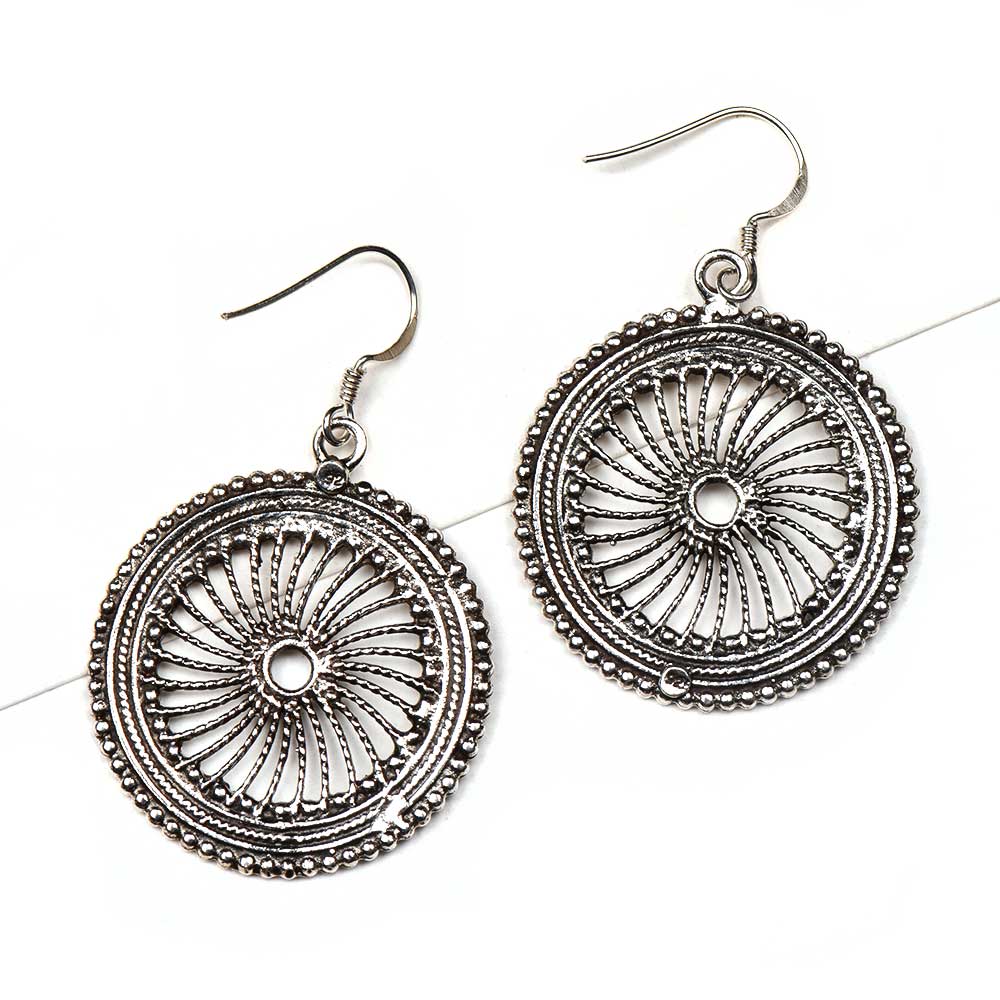 Side view showing round design on Reet dangle earrings