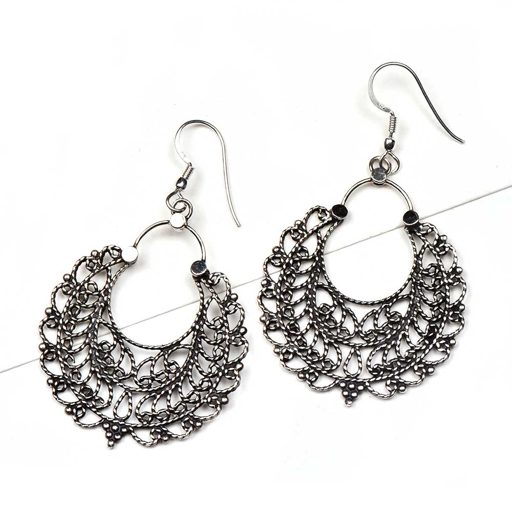 Side view showing tribal, filigree, drop design on Banjara drop earrings