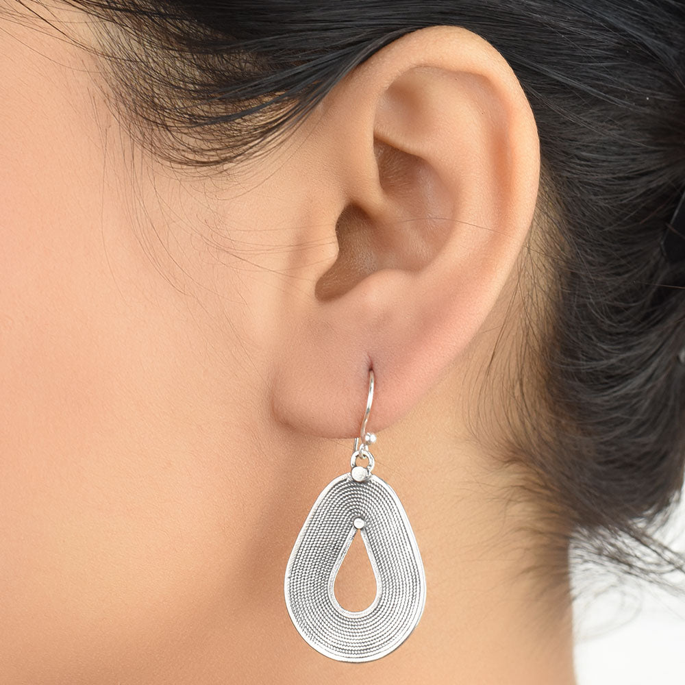 Front view of Reet oval dangle earrings in 92.5 Sterling Silver