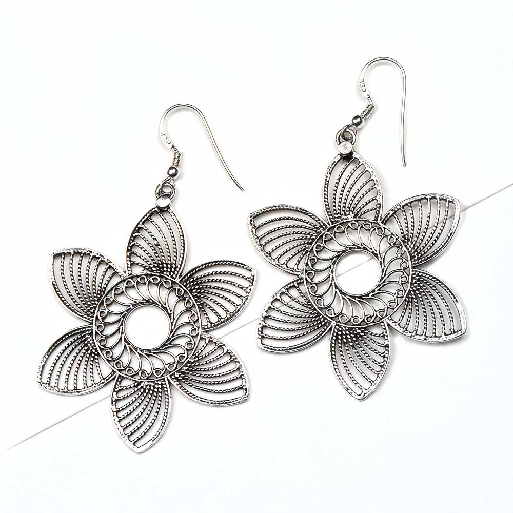 Side view showing floral design on Gul dangle earrings