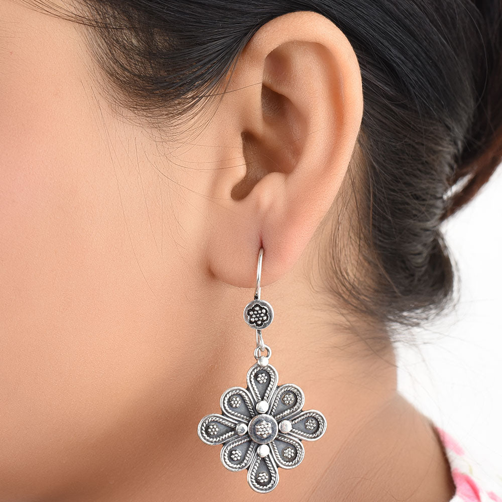 Front view of Gul floral dangle earrings in 92.5 Sterling Silver