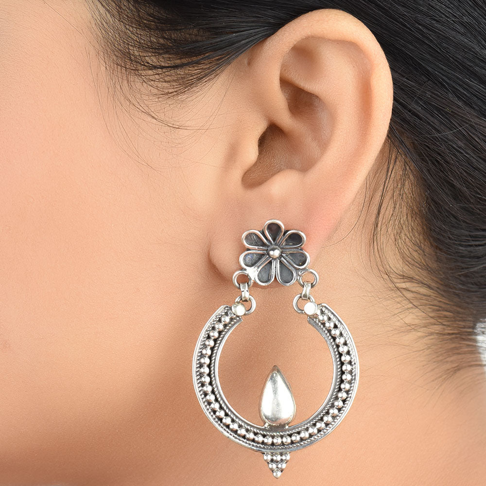Front view of Chaandni floral, crescent stud earrings in 92.5 Sterling Silver