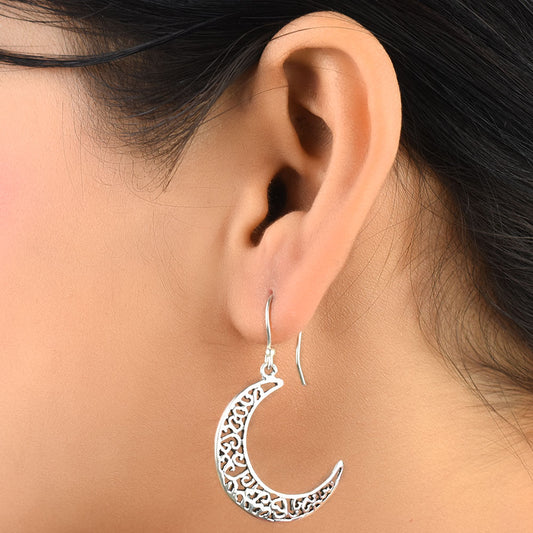 Front view of moonchild moon dangle earrings in 92.5 Sterling Silver