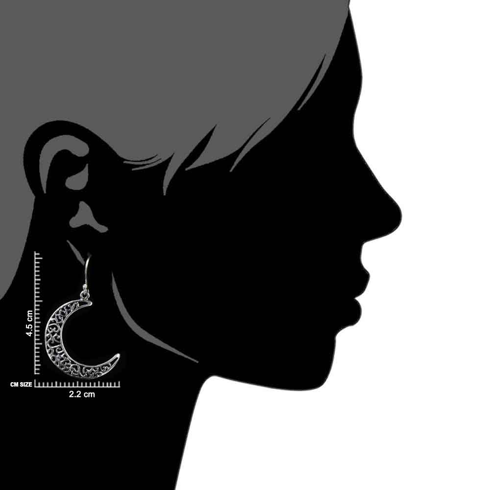 Close-up of intricate moonchild engraving in sterling silver