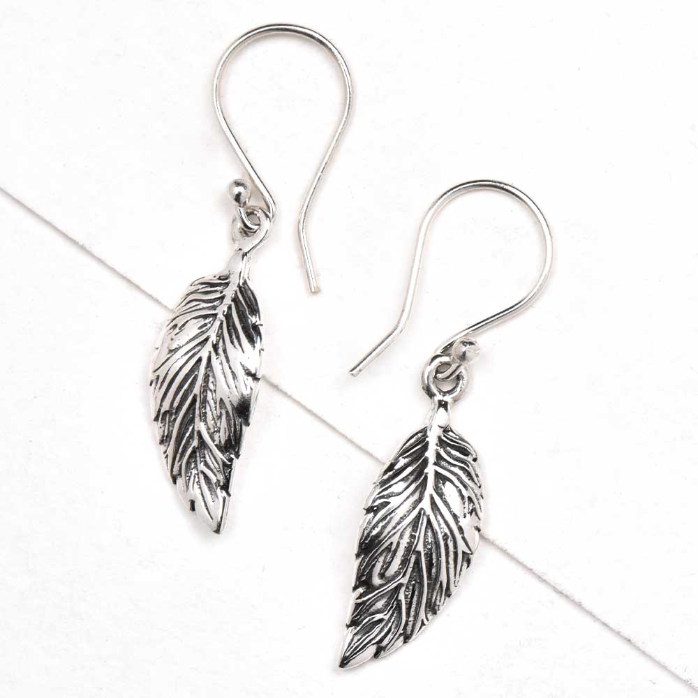 Detailed shot highlighting the craftsmanship of 92.5 sterling silver leaf earrings