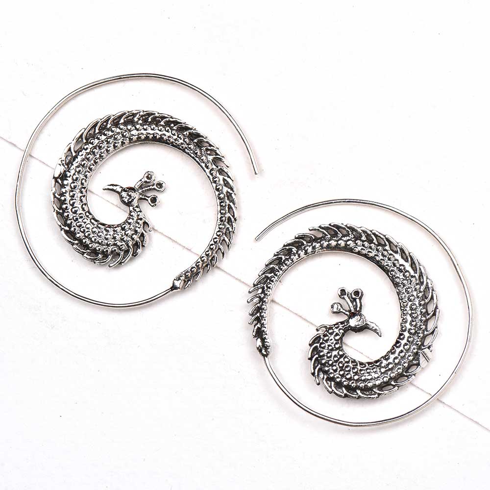 Pair of 92.5 sterling silver peacock earrings displayed elegantly