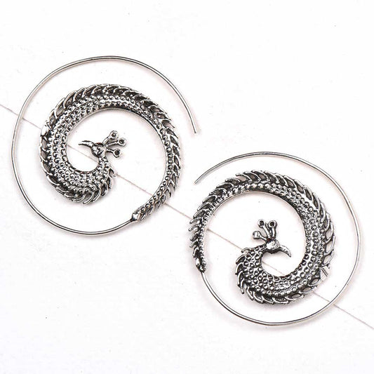 Pair of 92.5 sterling silver peacock earrings displayed elegantly