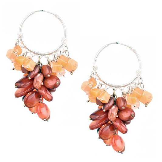 Pair of 92.5 sterling silver orange brown bead drop earrings displayed elegantly