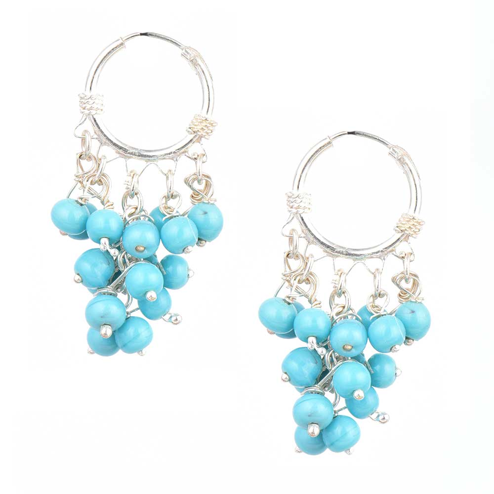 Pair of 92.5 sterling silver moonstone moon dangle earrings displayed elegantly