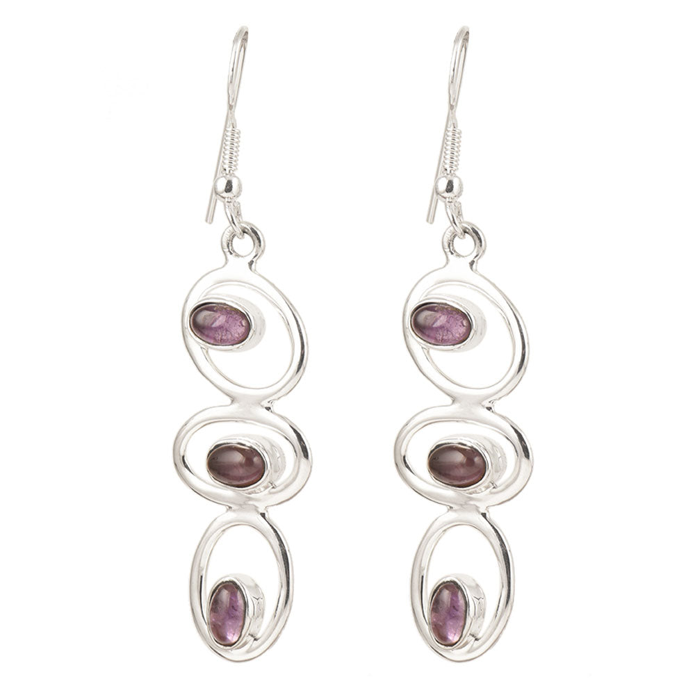 Lifestyle image of Amethyst Dangle Earrings complementing an outfit, with 92.5 Sterling Silver.