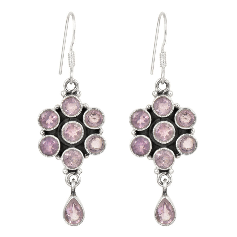 Lifestyle image of Amethyst Dangle Earrings complementing an outfit, with 92.5 Sterling Silver.