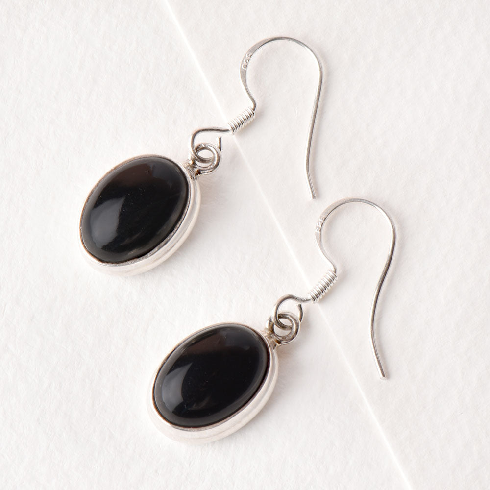 Angled view of Noir Onyx earrings in 92.5 Sterling Silver