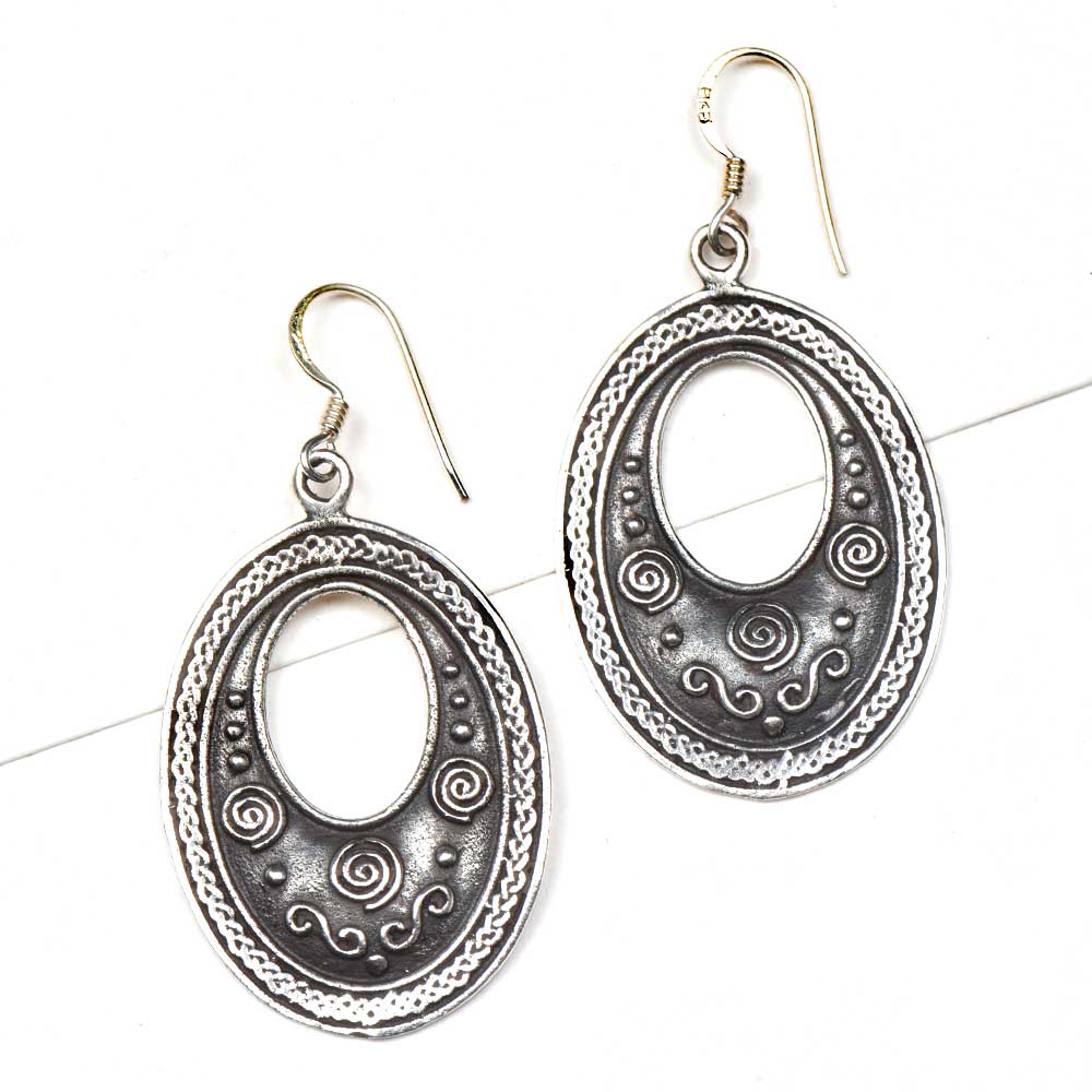 Handmade tribal and oval earrings showcasing traditional craft