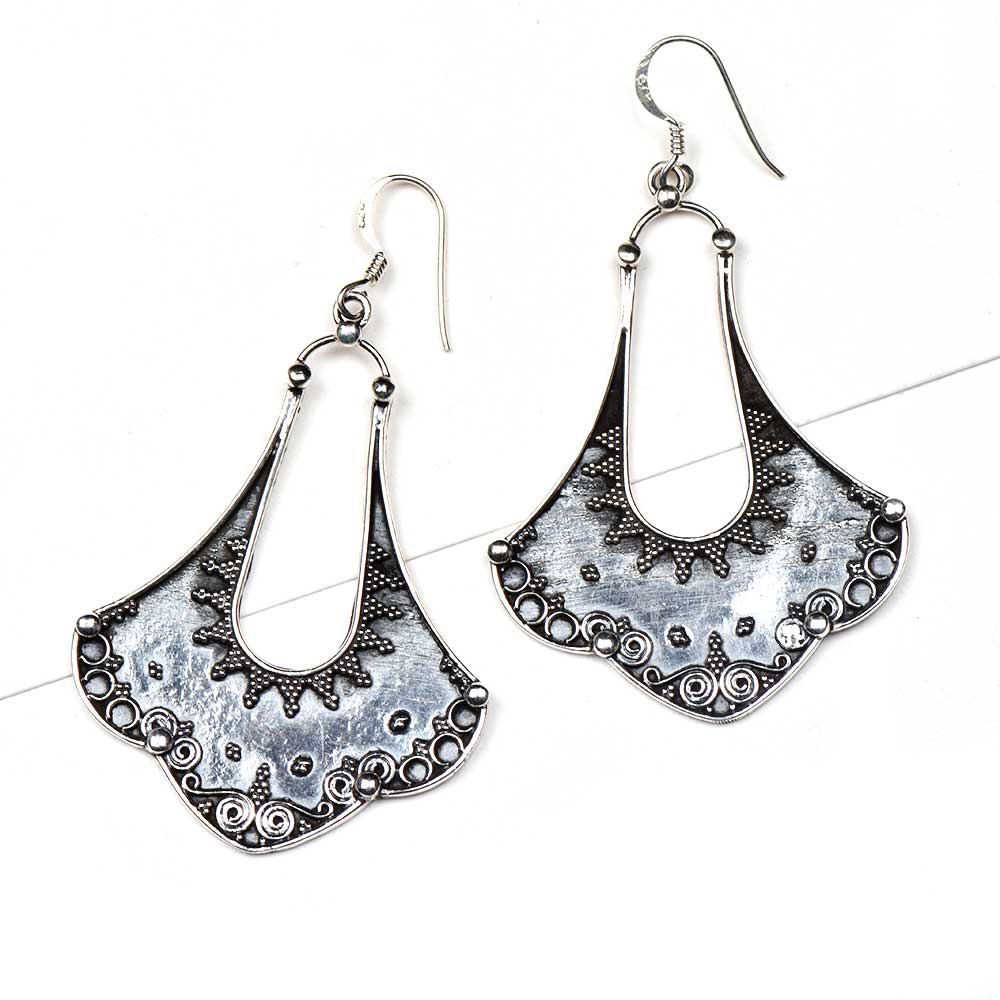 Angle view of Banjara dangle earrings capturing the shine of 92.5 Sterling Silver