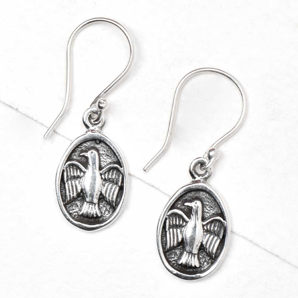 Close-up view of 92.5 sterling silver flying bird drop drop earrings design