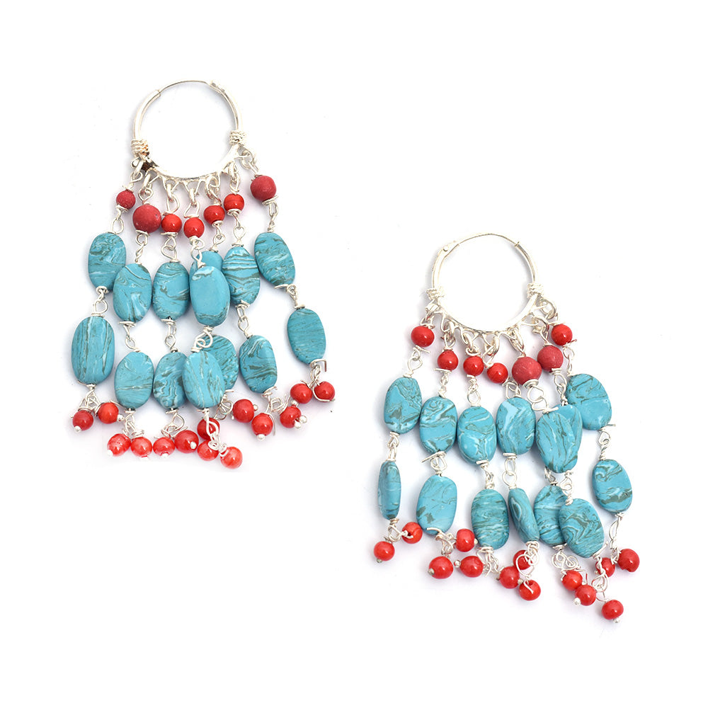 Artistic composition of turquoise hoop earrings with Multicolor embellishments and 92.5 Sterling Silver.