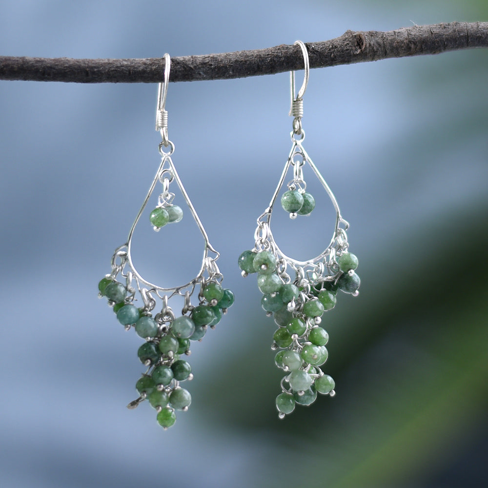 Model wearing Peridot Round Earrings, highlighting size and 92.5 Sterling Silver.